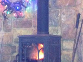 Jotùl Wood Burning Stove on Large creek rock Emerson’s Cabin